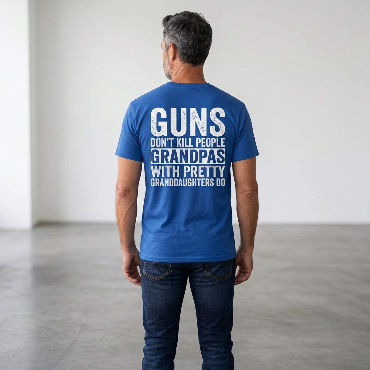 TrendyShift.Com blue heavy cotton t-shirt with white distressed text print on back worn by a man in jeans
