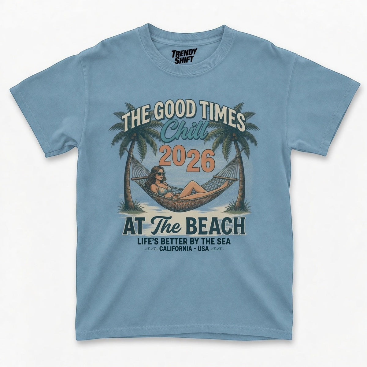 TrendyShift.Com light blue retro graphic t-shirt featuring a palm tree hammock beach scene and summer text
