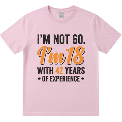 TrendyShift.Com light pink cotton t-shirt with humorous 60th birthday quote in black and orange vintage typography.