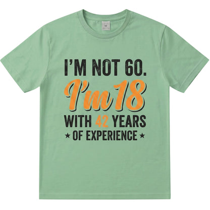TrendyShift.Com sage green cotton t-shirt with I’m not 60 I’m 18 with 42 years of experience vintage typography print