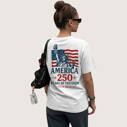 TrendyShift.Com white cotton unisex t-shirt featuring a Statue of Liberty and American flag 250th anniversary graphic.
