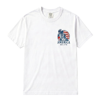 TrendyShift.Com white cotton unisex t-shirt featuring a Statue of Liberty and American flag graphic on the chest.